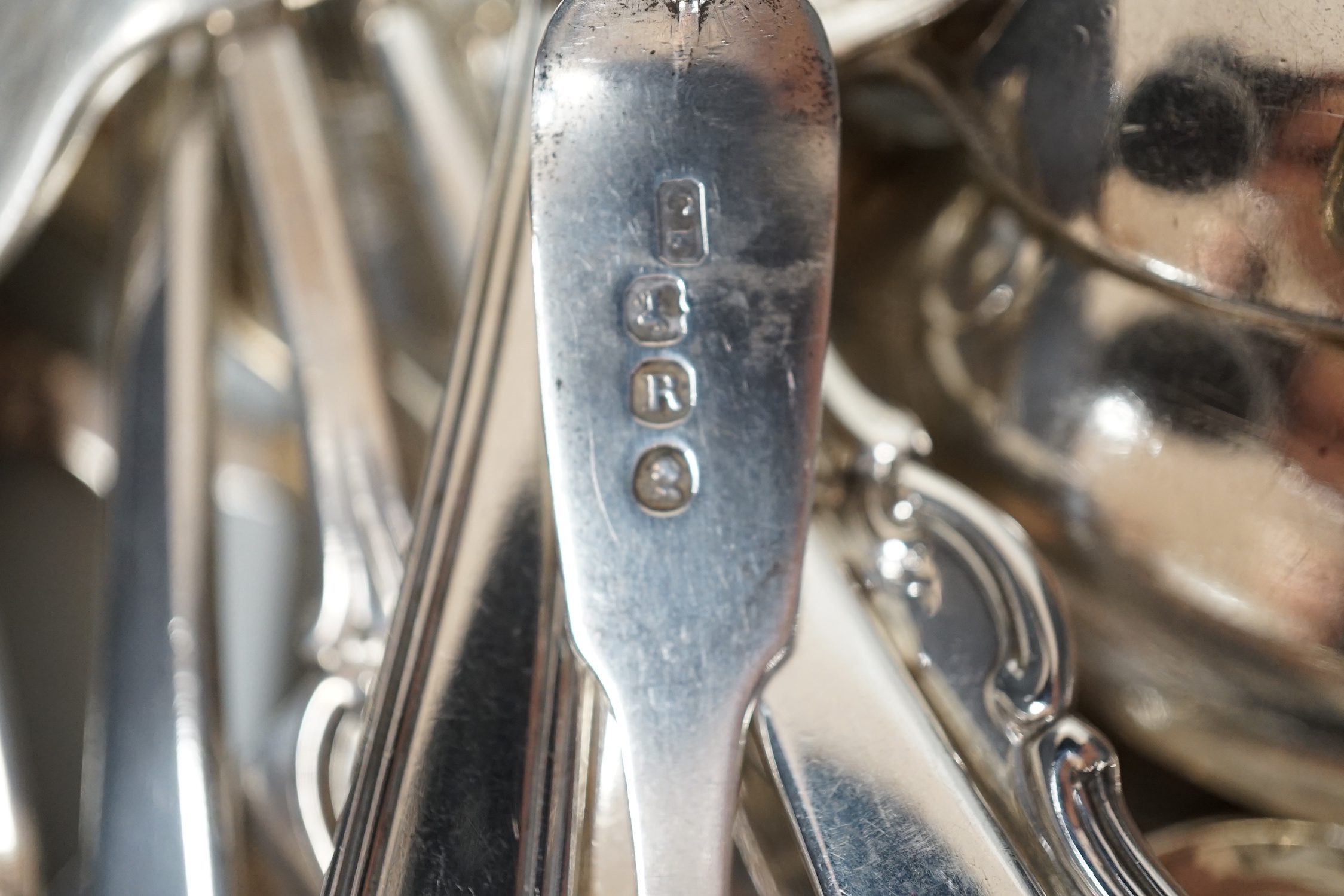 A canteen of mixed George III and later silver flatware, various patterns, dates and makers, 48.6oz.